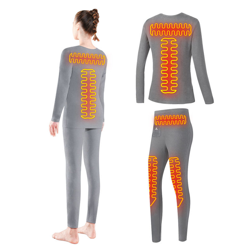 La capa baja femenina de la calefacción eléctrica calentó el traje termal de la ropa interior para los deportes de invierno