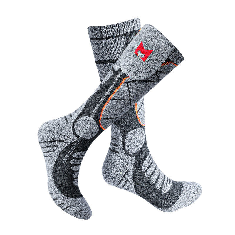 La termal caliente con pilas de los calcetines de las mujeres de los hombres que caminaba calentó los calcetines para el tiempo frío